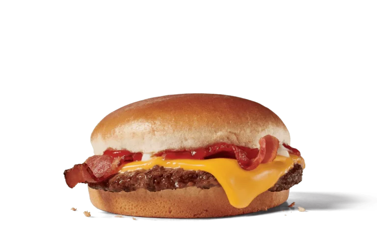 Image of a Jr. Bacon Cheeseburger featuring a beef patty topped with a slice of melted American cheese and crispy bacon strips, served on a soft, round bun.