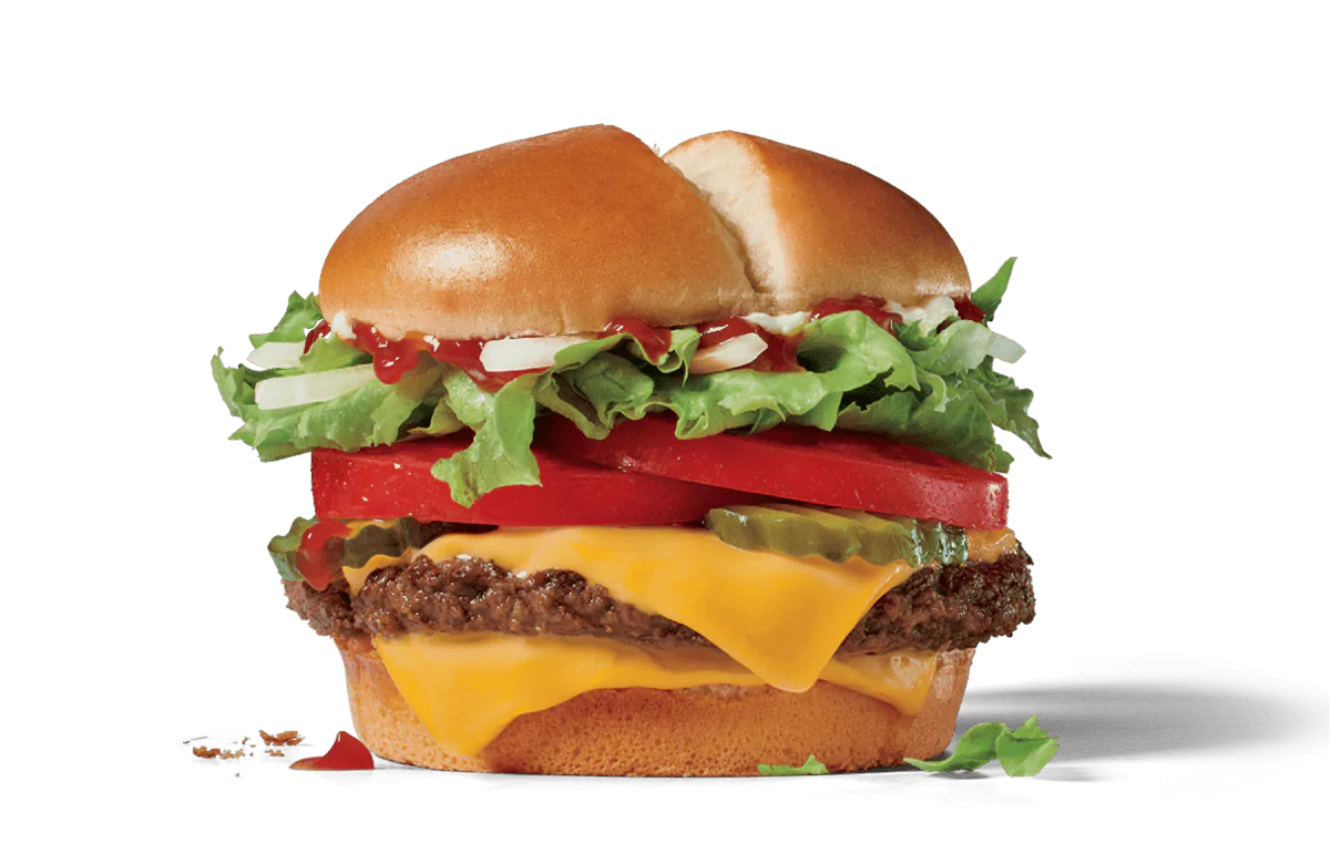 Image of a Jumbo Jack Cheeseburger with a beef patty, two slices of American cheese, fresh lettuce, thick tomato slices, and onions, topped with ketchup and mustard on a soft sesame seed bun.