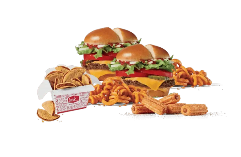An assortment of fast food items including two cheeseburgers with fresh toppings, a box of crunchy taco chips, curly fries, and crispy churros, all set against a dark background.