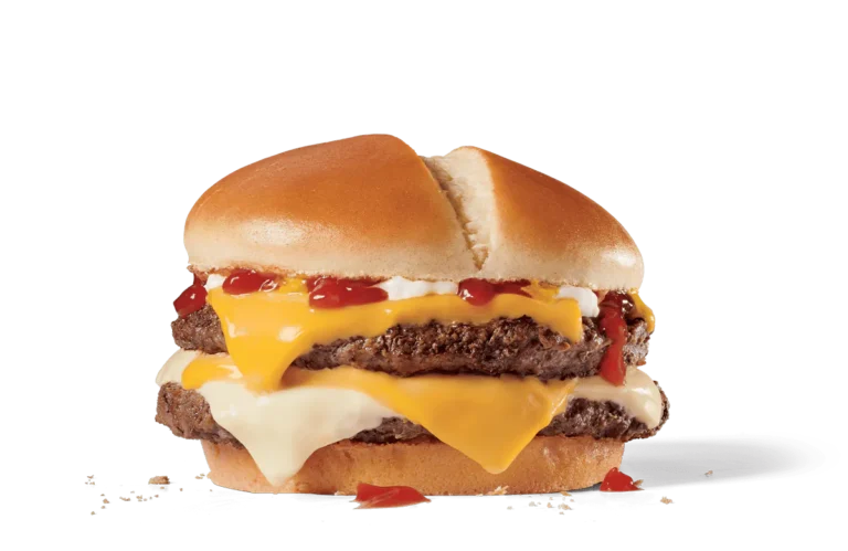 Image of an Ultimate Cheeseburger Deluxe with a double layer of beef patties, multiple slices of melted American cheese, crispy bacon, and generous dollops of ketchup and mayonnaise, served on a toasted bun.