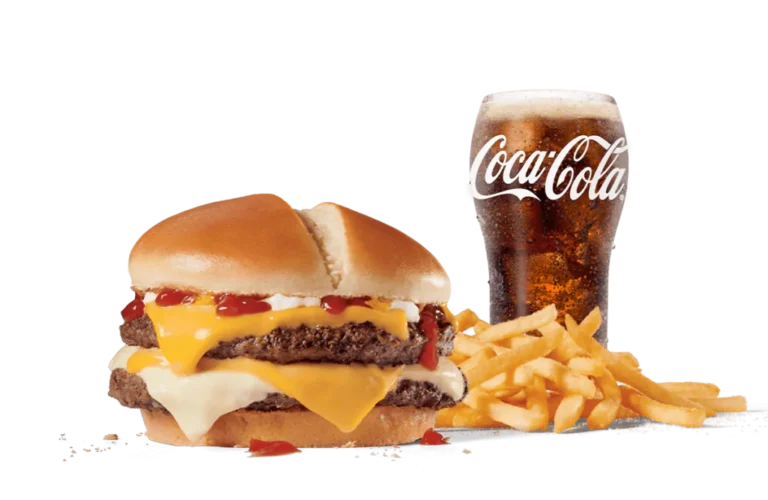 The Ultimate Cheeseburger™ Combo showcases a juicy double patty burger topped with layers of melting cheese and condiments, accompanied by crispy French fries and a chilled glass of Coca-Cola, set against transparent background.