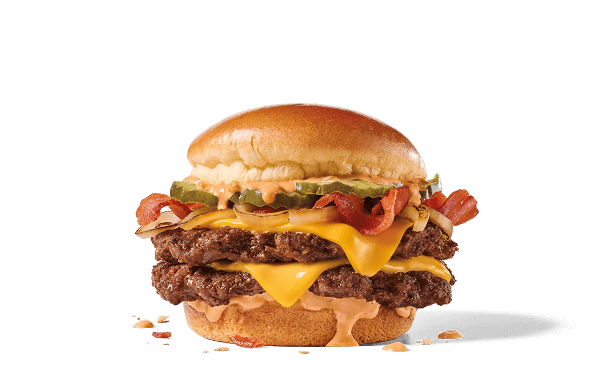 Bacon Double Smashed Jack burger with two beef patties, melted cheddar cheese, crispy bacon, pickles, onions, and creamy sauce, all on a toasted bun.