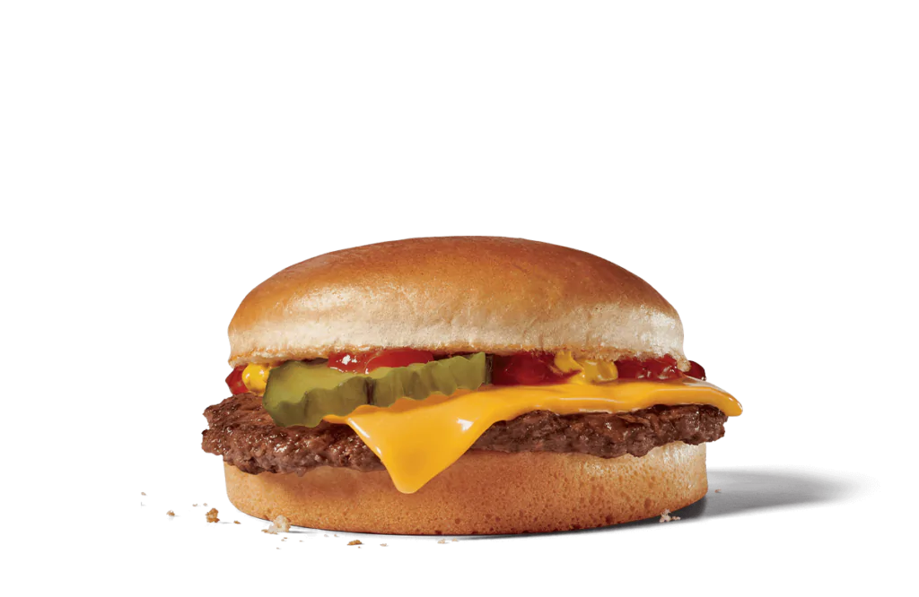 A close-up view of a classic cheeseburger featuring a perfectly toasted bun, a juicy beef patty, melted cheese, ketchup, and pickles. The cheeseburger is showcased against transparent background, highlighting its vibrant colors and delicious layers, making it a mouthwatering choice for any meal.