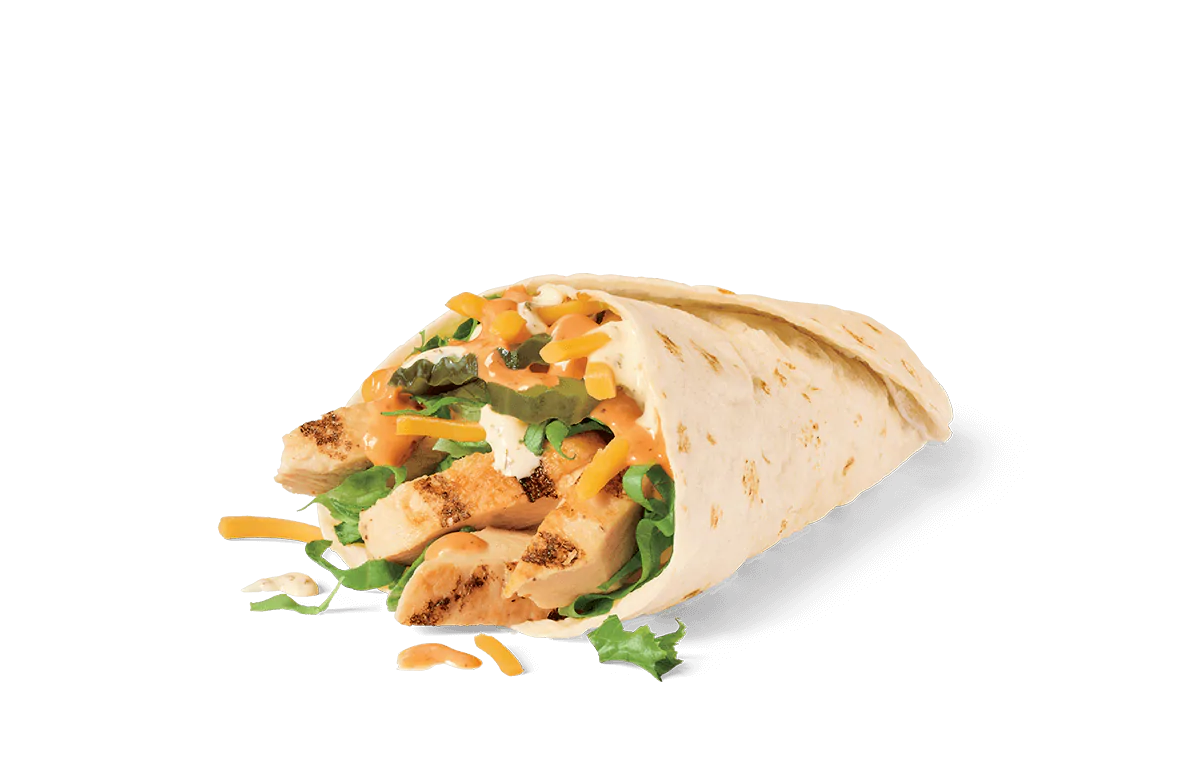 A close-up image of a grilled chicken wrap, sliced open to reveal the filling of diced grilled chicken, jack cheese, fresh lettuce, and a creamy orange sauce, all wrapped in a soft tortilla.