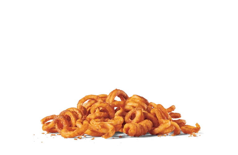 A pile of golden curly fries against transparent background. The fries have a crisp texture and are seasoned with a light coating of spices, giving them a vibrant orange hue. The curls vary in size and shape, adding visual interest to the arrangement.