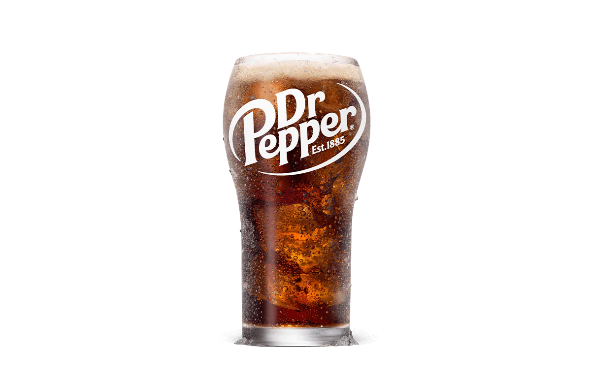 A tall glass of Dr Pepper soda, effervescent and deep amber in color, with the distinctive Dr Pepper logo emblazoned in white on the glass. The glass is filled to the brim, showcasing the drink's bubbly texture against a simple, transparent background.
