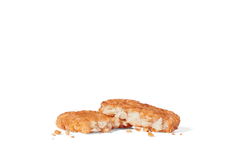 Image of crispy hash browns with a golden-brown exterior, showcasing the textured, crunchy surface and visible tender, shredded potato inside.