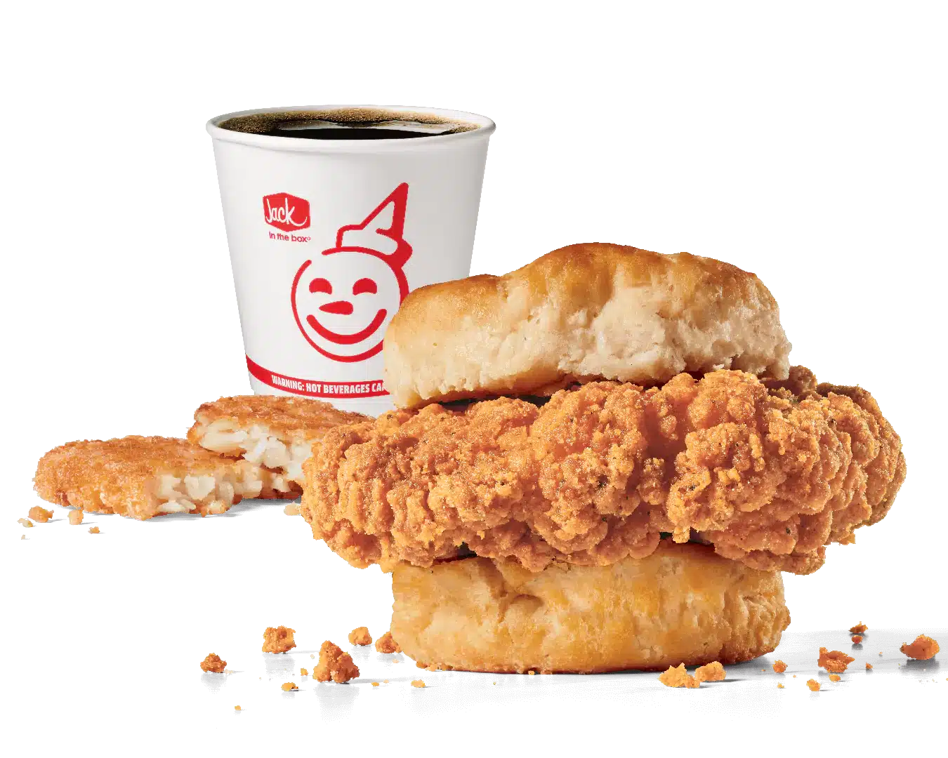 Promotional image of Jack in the Box's Homestyle Chicken Biscuit Combo featuring a crispy chicken fillet sandwiched in a soft biscuit, accompanied by a hash brown and a coffee cup with the red Jack in the Box logo. The chicken's crunchy coating and flaky biscuit are highlighted against a transparent background, showcasing a popular breakfast choice.