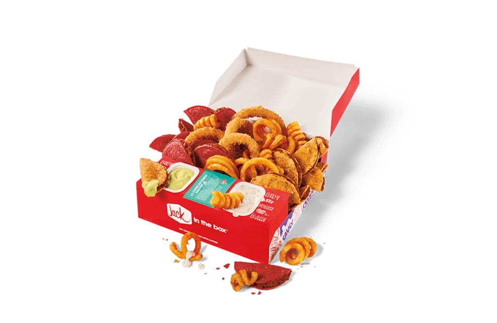 An open Jack in the Box 'Fan Favs' box filled with a variety of snacks. The box includes curly fries, crispy chicken nuggets, mozzarella sticks, and spicy chicken strips, accompanied by small containers of dipping sauces. The presentation is vibrant, with the items neatly arranged in a red and white branded box.