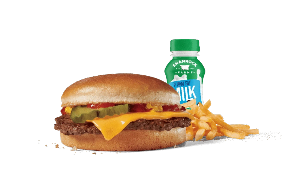 A tasty junior cheeseburger combo meal featuring a cheeseburger with a beef patty, cheese, ketchup, mustard, and pickles on a sesame seed bun, served with crispy golden fries and a bottle of low-fat milk. The items are presented against transparent background, showcasing the appealing, colorful contrast and inviting look of this kid-friendly meal option.