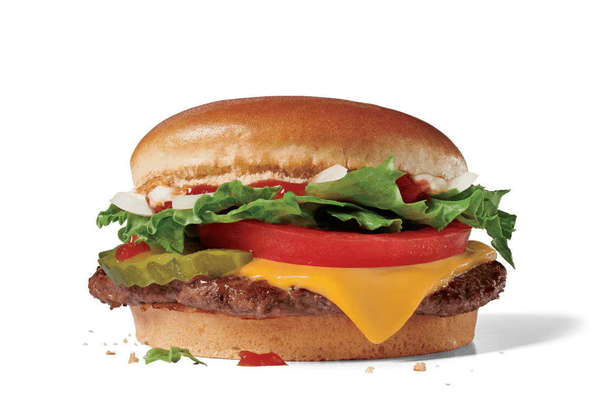 A Jr. Jumbo Jack® cheeseburger with a beef patty, melted cheese, fresh lettuce, tomato, and pickles on a toasted bun, set against a transparent background.