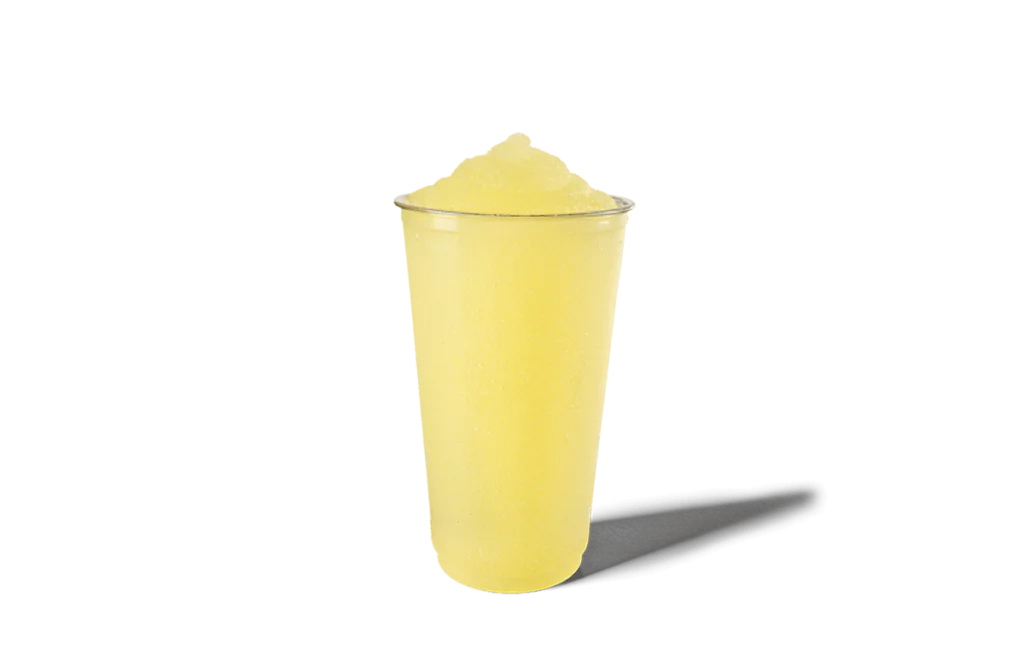 A clear cup filled with a bright yellow lemonade slushie. The drink has a smooth, icy texture, making it a refreshing and tangy treat for warm days.