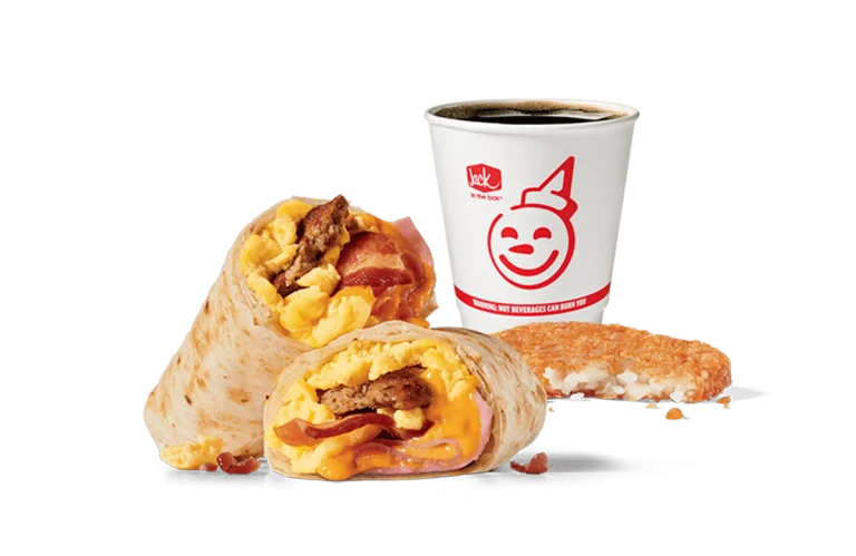 Image showcasing Jack in the Box's Meat Lovers Burrito Combo, featuring a breakfast burrito stuffed with sausage, bacon, scrambled eggs, and melted cheese, cut in half to reveal the filling. The combo includes a crispy hash brown and a coffee cup with the smiling Jack in the Box logo on a transparent background, emphasizing a hearty and satisfying breakfast option.
