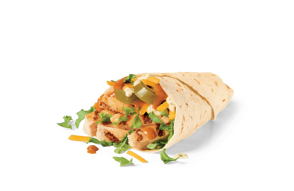 A halved spicy grilled jack wrap against transparent background. The wrap is filled with chunks of grilled chicken, melted jack cheese, fresh lettuce, diced green peppers, and a spicy orange sauce, with bits of the filling spilling onto the surface below.