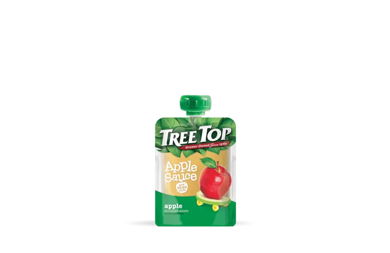 A Tree Top apple sauce pouch on transparent background. The pouch is prominently displayed, showing a bright red apple and green leaves on the packaging. The label reads 'Tree Top Apple Sauce, No Sugar Added, Grower Owned Since 1960, apple,' emphasizing the natural ingredients and heritage of the brand.