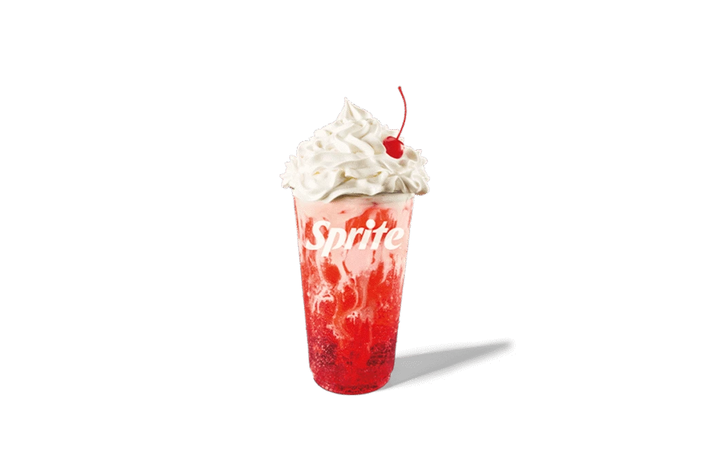 A refreshing Sprite® Strawberries & Cream Twisted Soda topped with whipped cream and a cherry, featuring a vibrant red strawberry swirl in a clear cup with the Sprite logo.